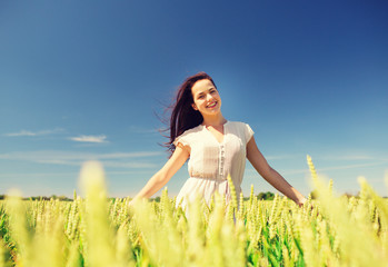 smiling young woman on cereal field