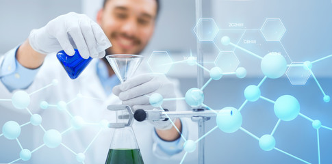 close up of scientist with test tubes and funnel