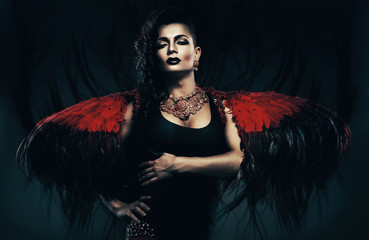 angel transvestite in red wings