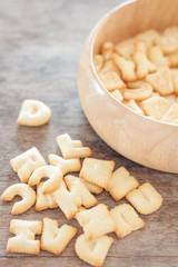 Alphabet biscuit in wooden tray