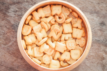 Alphabet biscuit in wooden tray