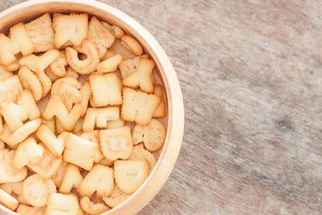 Alphabet biscuit in wooden tray