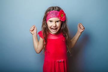 a girl of seven European appearance brunette in a bright dress c