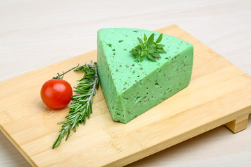 Green pesto cheese and basil leaves