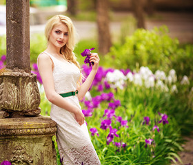 Beautiful young woman in spring garden