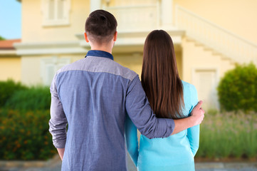 Loving couple looking at their dream house