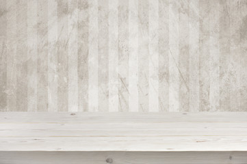 Empty wooden planks table top over grunge wall background