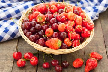 Cherries and strawberries on vintage table