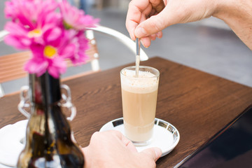 drinking coffee on a terrace