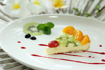Fruit cheese pie on white dish