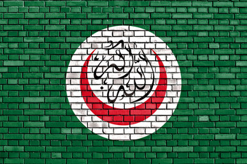 flag of OIC painted on brick wall