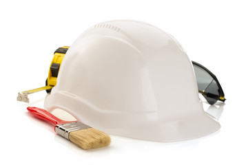 construction helmet and safety glasses on white