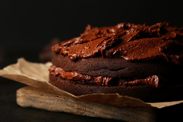Tasty chocolate cake on table, close-up