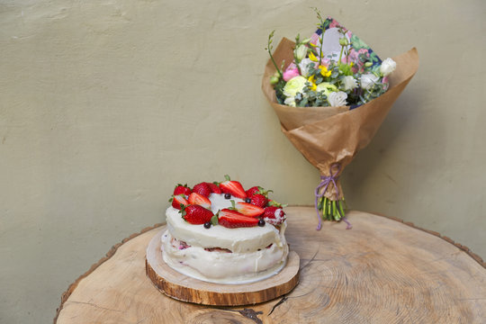 Strawberry cake on wooden table