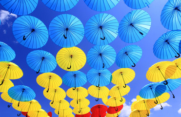 Fototapeta na wymiar colorful umbrellas in the blue sky