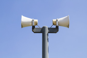 Speaker in public on blue sky