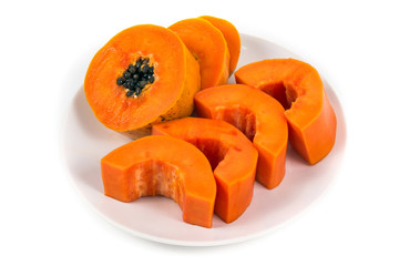 Isolated ripe papaya in the white dish