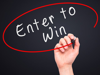 Man Hand writing Enter to Win with marker