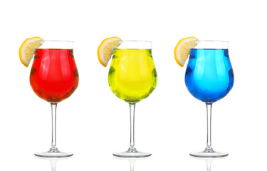Set of beautiful shot glasses filled with colored alcoholic cocktails