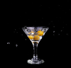 Vermouth cocktail inside martini glass over dark background