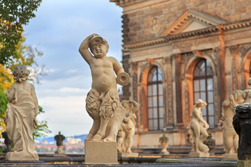 Fototapeta na wymiar Closeup stone statue of child faunus at Zwinger palace in Dresde