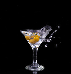 Vermouth cocktail inside martini glass over dark background
