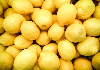 Yellow lemons in the supermarket/ Close up image