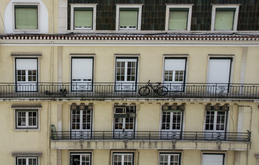Fototapeta na wymiar Bicycle on Balcony of Apartment Block