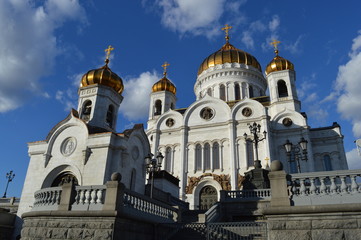 Fototapeta na wymiar Church with gold cross in sunshine (Moscow downtown)