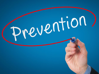 Man Hand writing Prevention with marker on visual screen. 