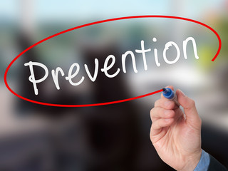 Man Hand writing Prevention with marker on visual screen. 