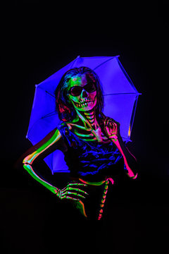 Skeleton bodyart with blacklight studio portrait