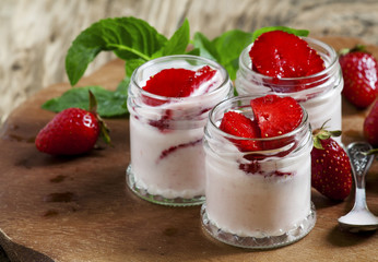 Homemade strawberry yogurt with fresh wild strawberries and mint