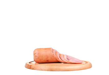 Large piece of ham with cut slices on wooden platter, isolated on white background