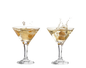 Splash from olive in a glass of cocktail, isolated on the white