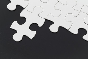Puzzle over black background