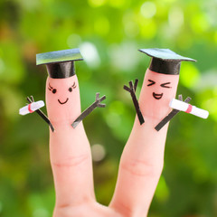 students holding their diploma after graduation 