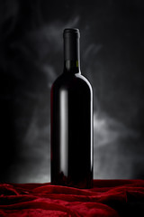 wine bottle on red velvet