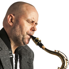 Adult man playing his saxophone