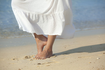woman meditating and relaxing on beach
