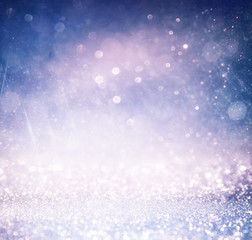 glitter vintage lights background with light burst 
