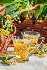 Tea with lime and honey served in the garden at summer