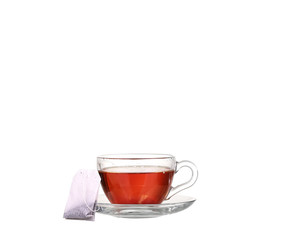 Cup of tea with teabag on white background