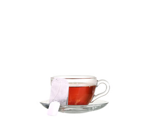 Cup of tea with teabag on white background