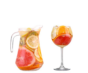 pitcher with a refreshing drink with lemon slices of orange and