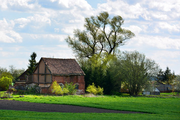 Naklejka na ściany i meble Spring landscape with old farm