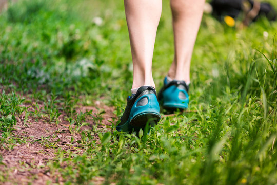 Closeup of running shoes of woman barefoot.