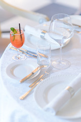 Cocktail with a bunch of mint served on the table