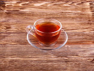 Cup of tea on a wooden background top view