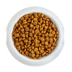Dry pet food in a white bowl isolated on white